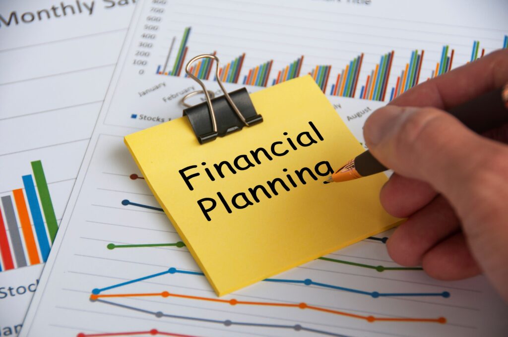 financial planning text yellow notepad with financial data analysis background financial planning concept 1 1024x680